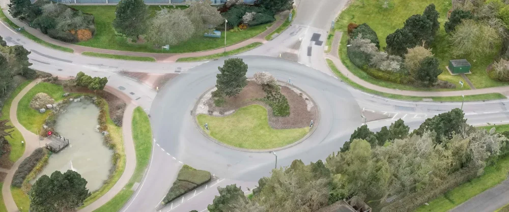 Timothy Simmons, UK Business Park Roundabout (southwest view above the tree canopy to the new town), 2023. From Remnants of the Anthropocene.